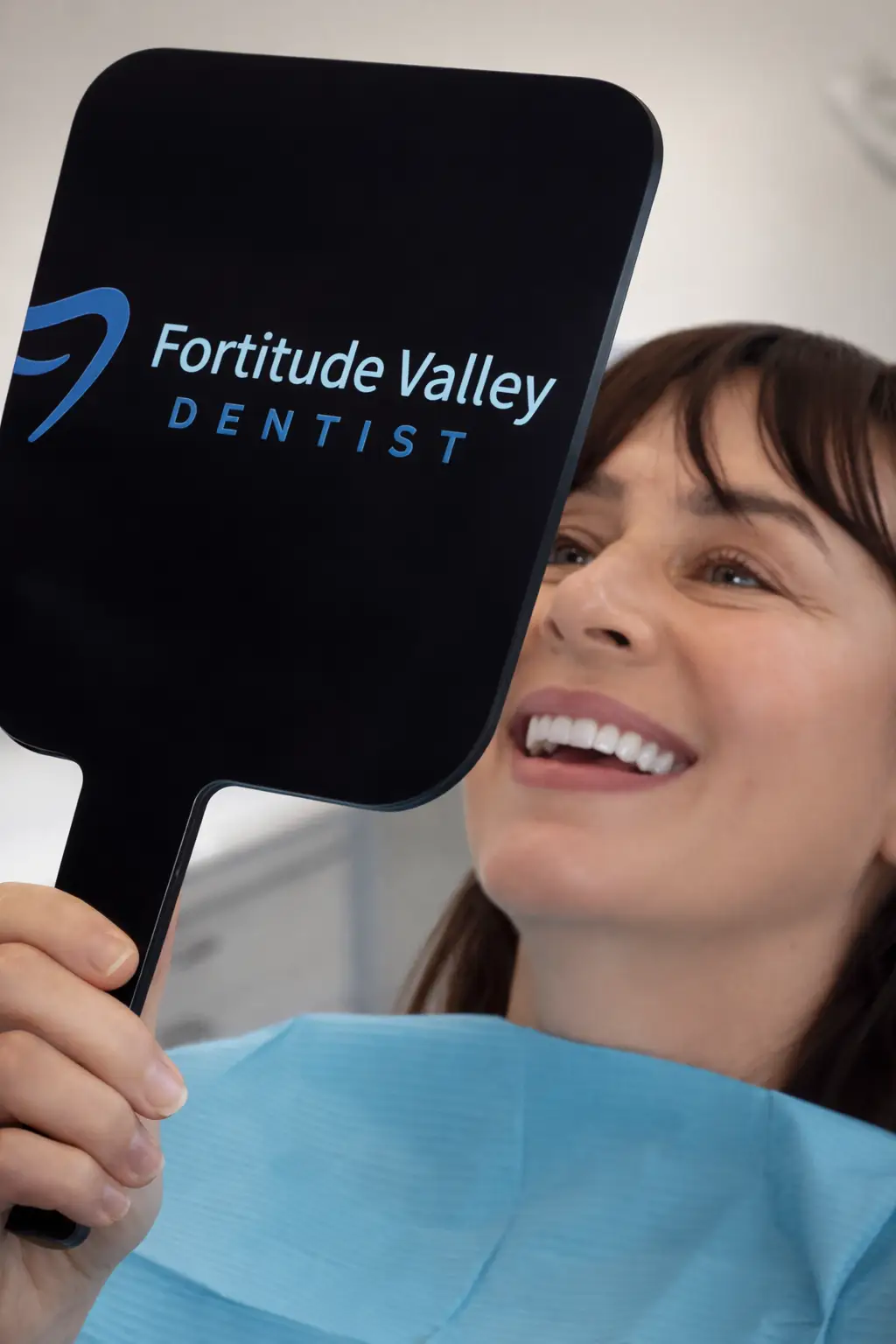 Woman smiling into Fortitude Valley mirror